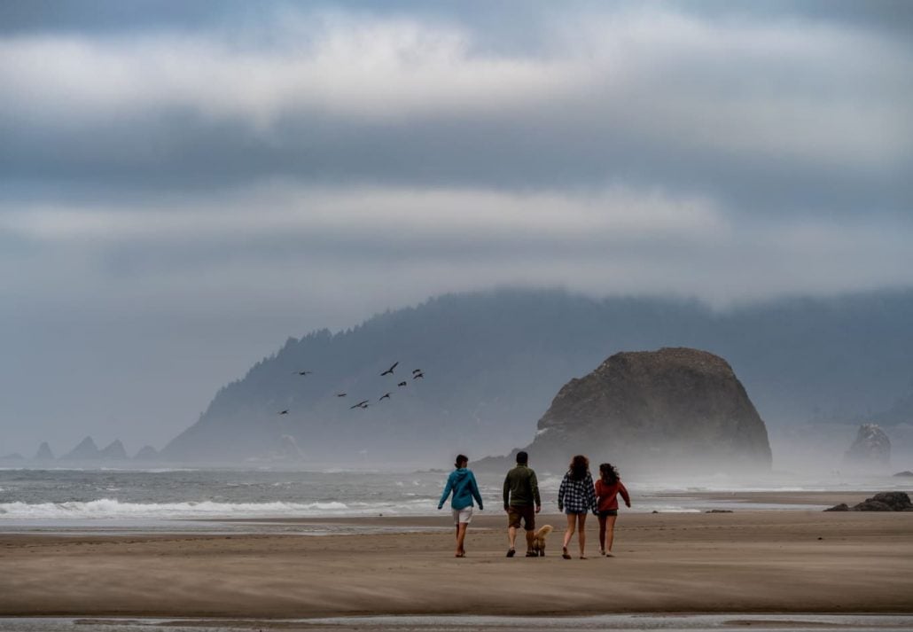 Peope walking in the Hug Point State Recreation Site, Oregon.