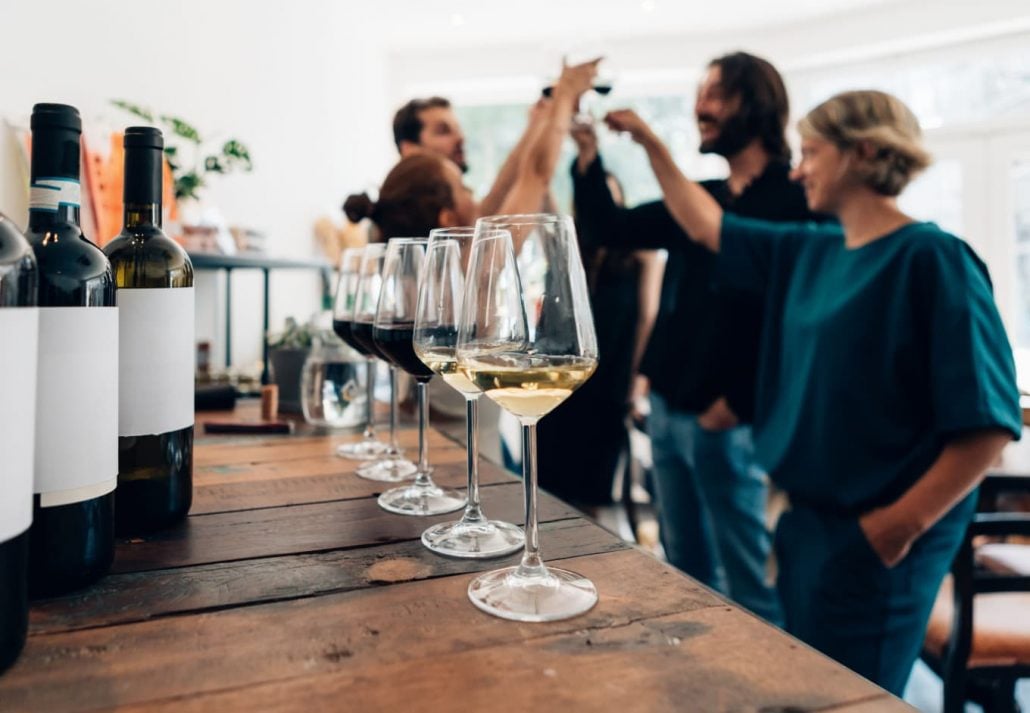 Friends toasting at a wine tasting.