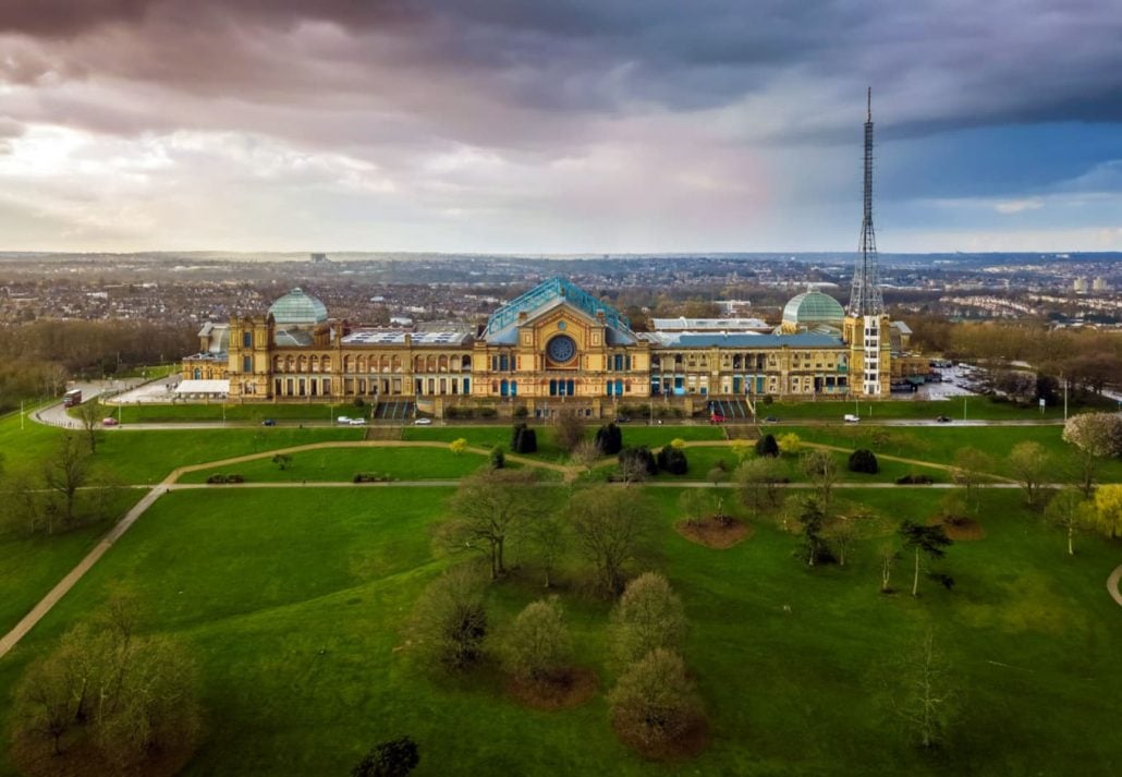 Aerial panoramic view of Alexandra Palace in Alexandra Park with dramatic clouds behind, in London, UK.