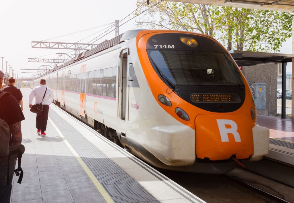 Passengers Board the Renfe train at El Prat airport at the station in Barcelona, Spain.