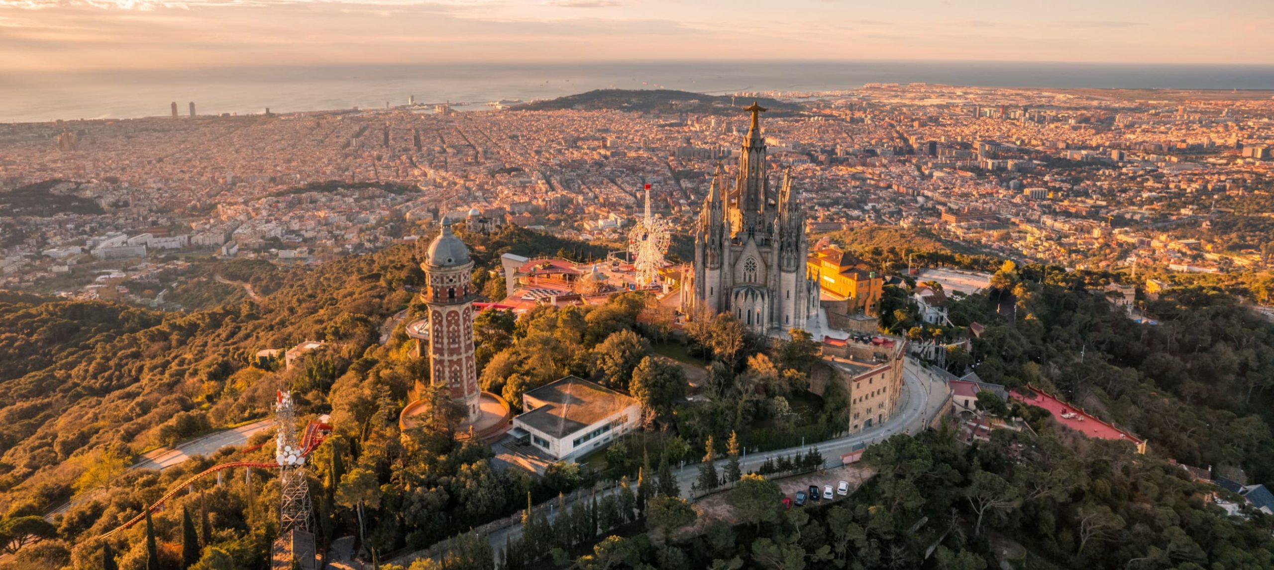 Aerial view of Barcelona skyline with Sagrat Cor temple during sunrise, Catalonia, Spain.