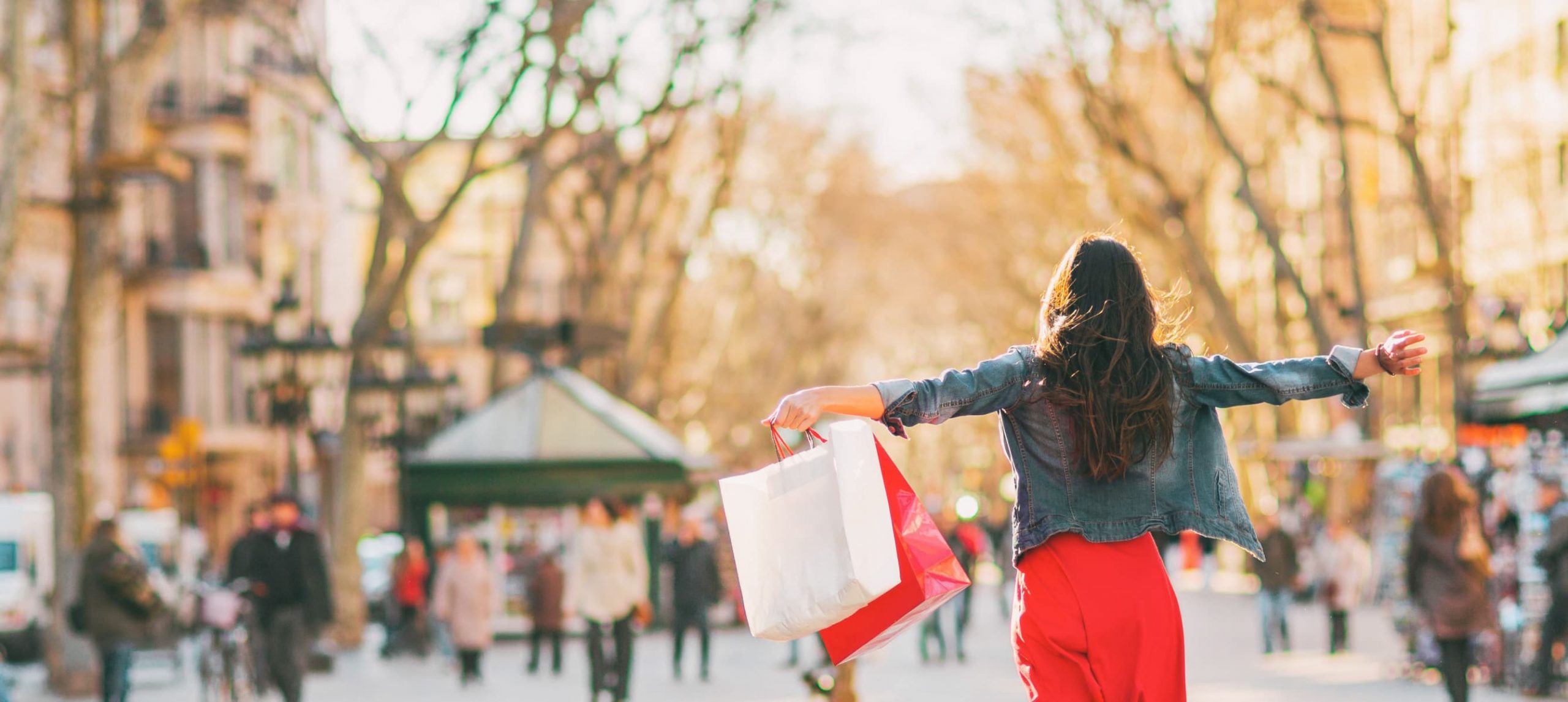 A woman happily shopping in La Rambla, Barcelona, Spain.