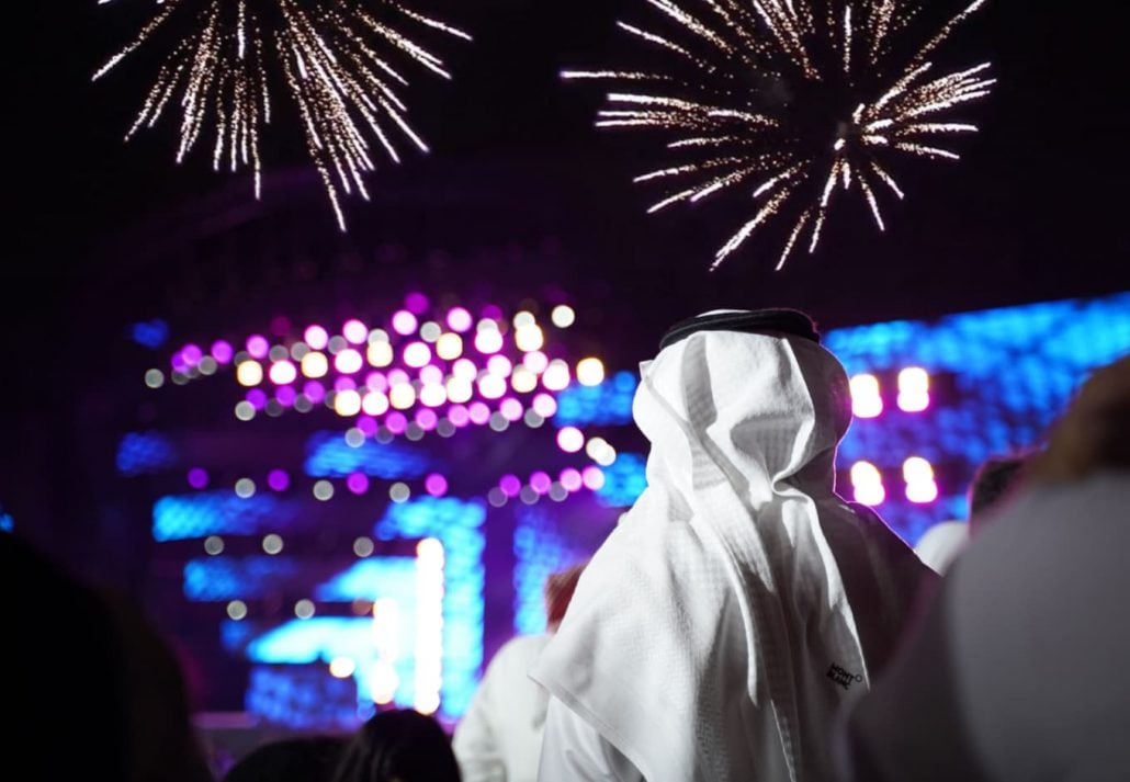an Arab man looking at fireworks