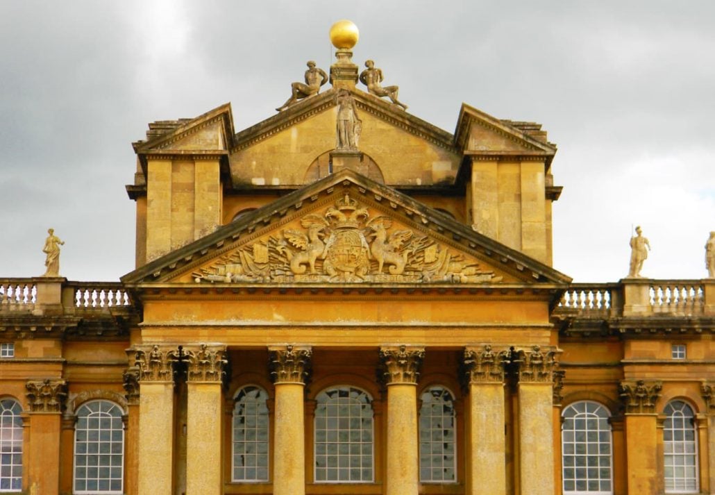 statues and a golden sphere on top of the Blenheim Palace