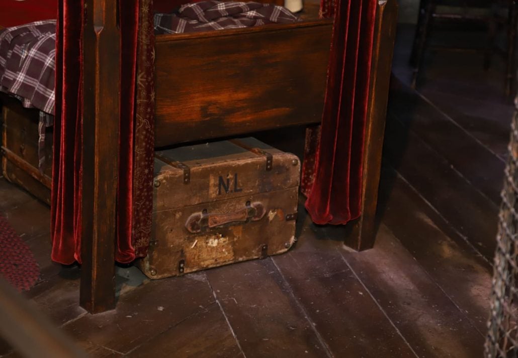 a wooden luggage stored under the bed at Warner Bros Harry Potter Studio