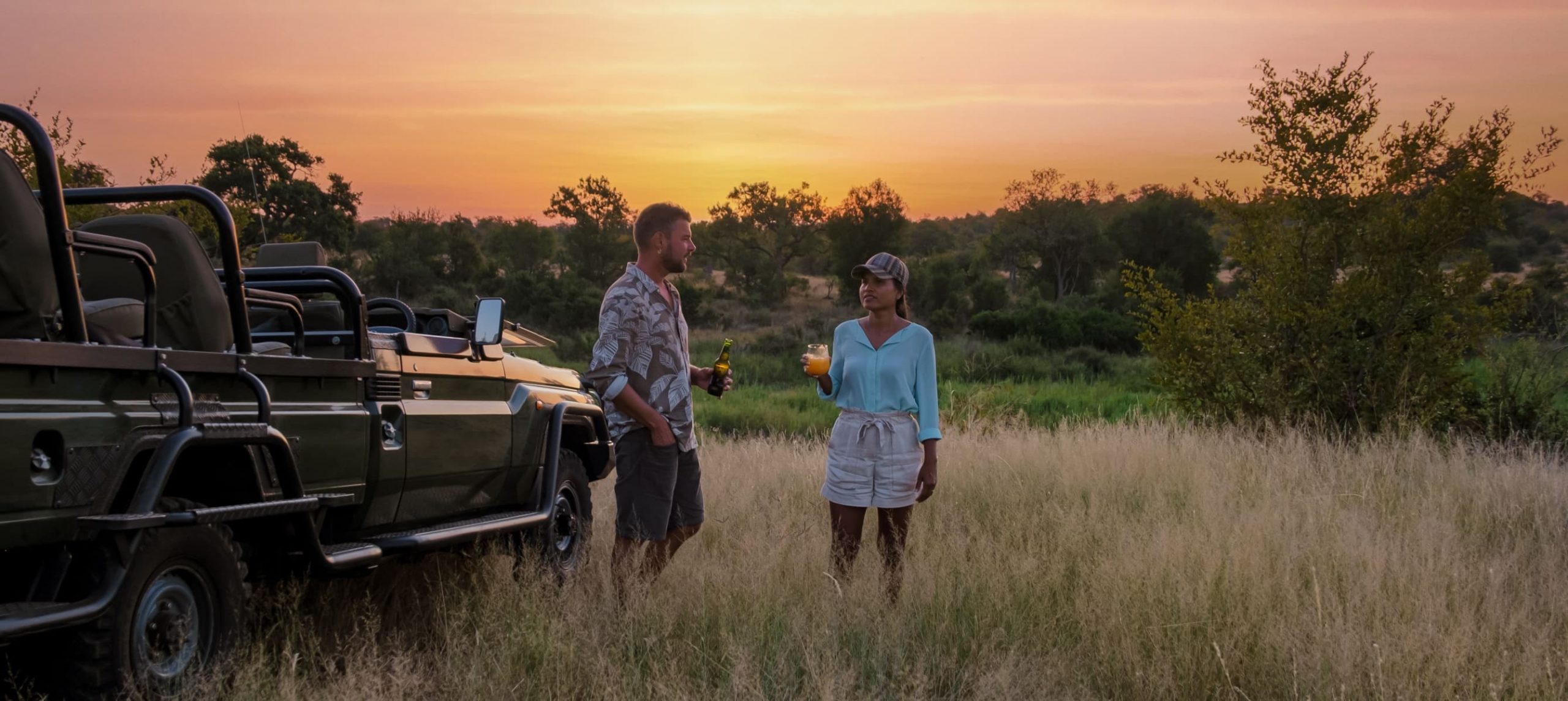 a man and a woman hanging out on a safari