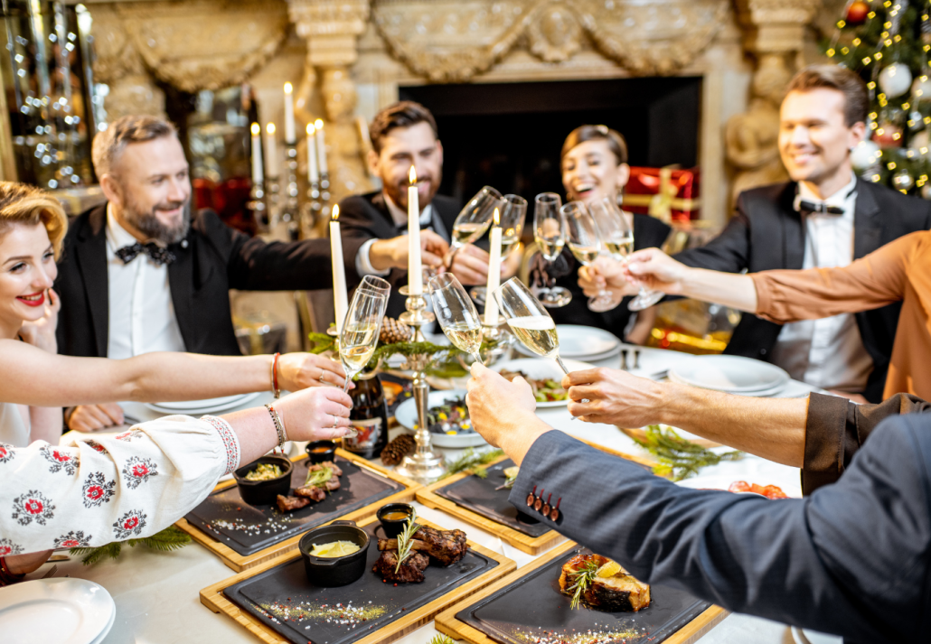 Elegantly dressed people celebrating New Year holiday indoors
