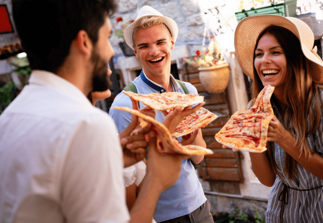  Happy people eating fast food  at a festival in Italy 