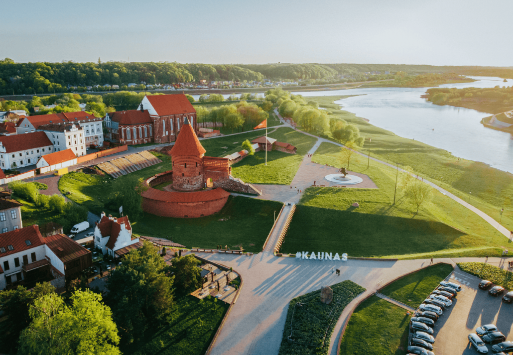 underrated european cities without crowds Aerial shot of Kaunas castle and beautiful landscape on a sunny day in Lithuania