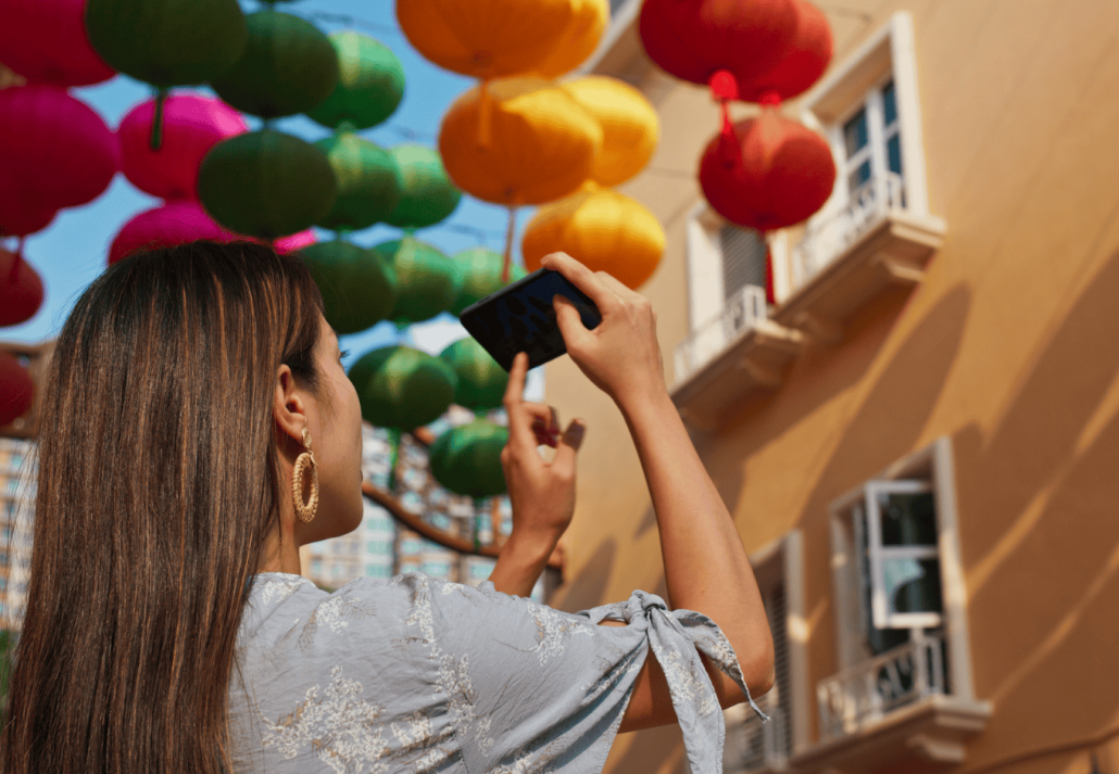 Woman take photo on cellphone at Santa Barbara Art Walk. santa barbara events
