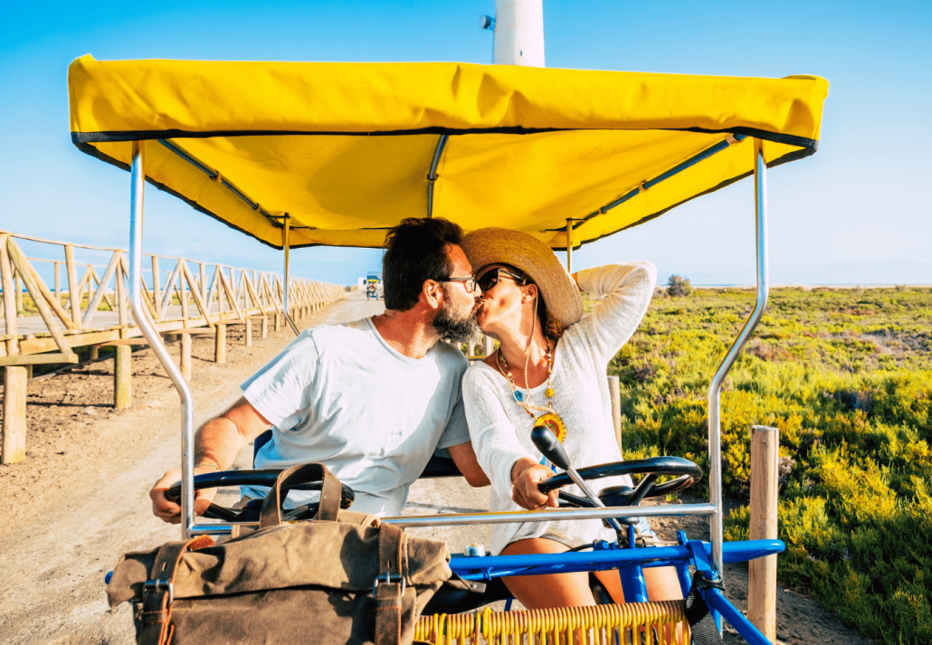 Happy adult couple enjoy and love together in jeep tour at vineyard 
