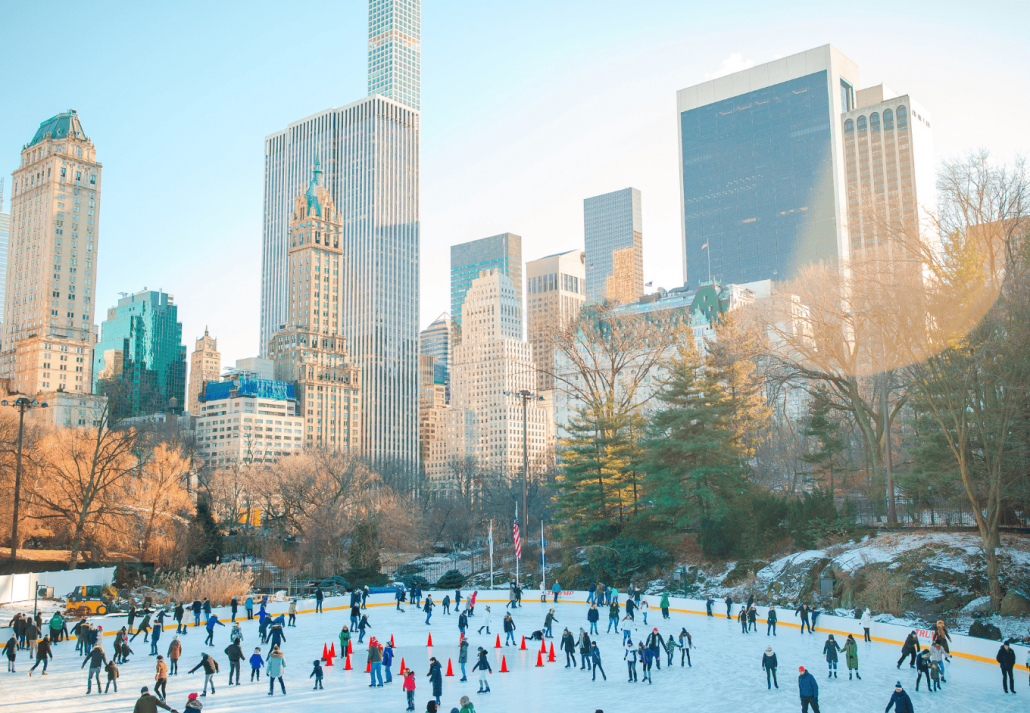 Ice skaters having fun in New York Central Park in winter