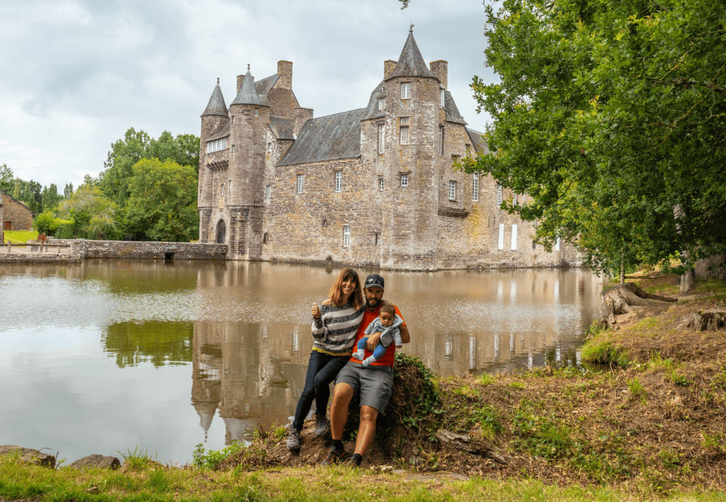 A young family visiting the medieval lakeside Chateau Trecesson