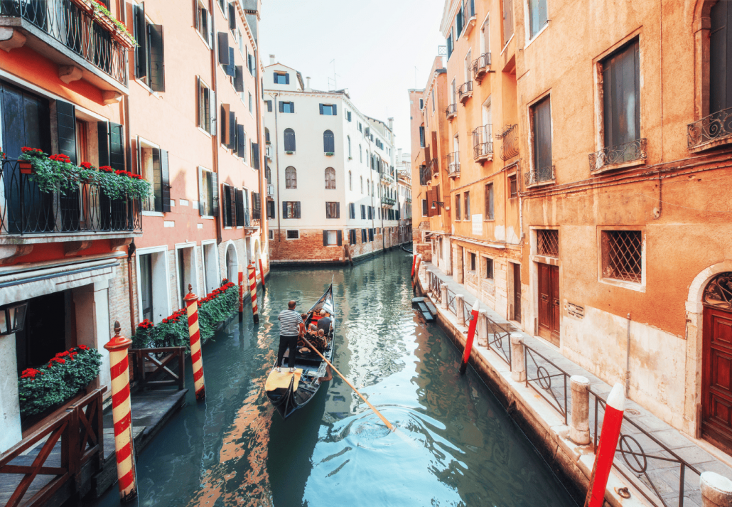  Gondolas on canal in Venice. Venice is a popular tourist destination of Europe.