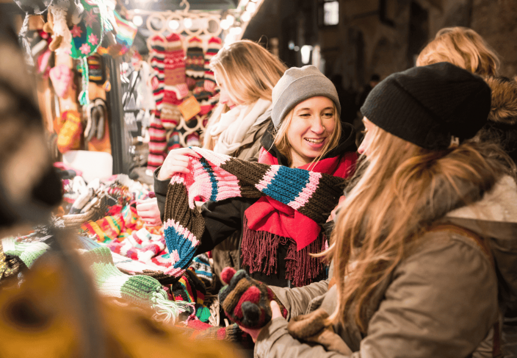 Happy young women shopping at Christmas market in Seattle