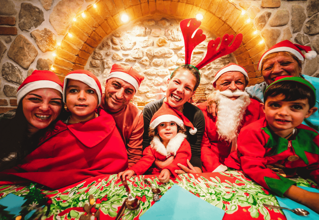 Happy Large Family Taking Photo In Front Of Camera